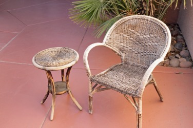 Outdoor furniture showing the effects of weathering. Outdoor furniture showing the effects of weathering.