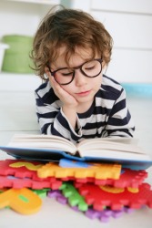 Precocious would be a toddler who can read. Precocious would be a toddler who can read.