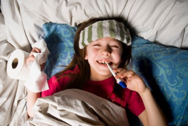 A little girl feigns illness. A little girl feigns illness.