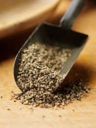 A scoop of course ground black pepper. A scoop of course ground black pepper.