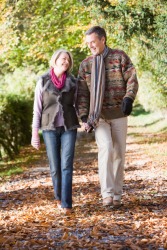 Two people walking alongside each other. Two people walking alongside each other.