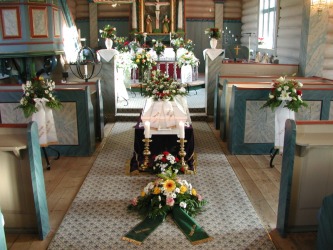 A coffin in a church ready for a funeral. A coffin in a church ready for a funeral.