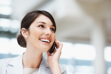 A woman using a mobile phone. A woman using a mobile phone.