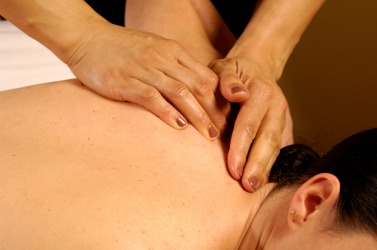 A woman gets a back rub. A woman gets a back rub.