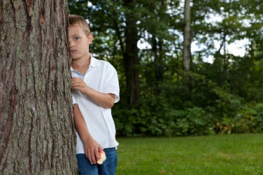 A child being coy. A child being coy.
