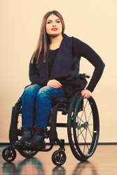 A woman who uses a wheelchair. A woman who uses a wheelchair.