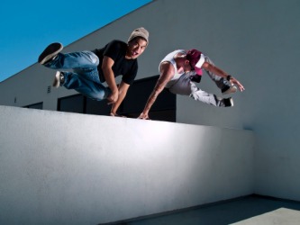 Young men practicing the sport of parkour. Young men practicing the sport of parkour.