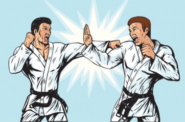 An opponent put up his hand to parry the karate punch. An opponent put up his hand to parry the karate punch.