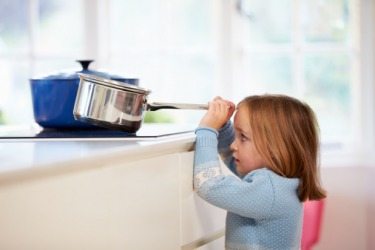 The child was in a perilous situation when she tried to take a pot off of the stove. The child was in a perilous situation when she tried to take a pot off of the stove.