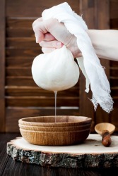 The permeable qualities of the cheese cloth allow the liquid to be squeezed from the homemade mozzarella. The permeable qualities of the cheese cloth allow the liquid to be squeezed from the homemade mozzarella.