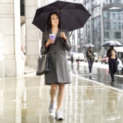 The persistent rain made walking to work a difficult challenge because she had to carry her briefcase, coffee as well as an umbrella. The persistent rain made walking to work a difficult challenge because she had to carry her briefcase, coffee as well as an umbrella.