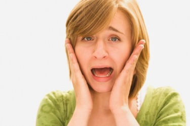 A woman reacting in a phrenic manner. A woman reacting in a phrenic manner.