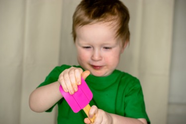 Nathan is bending the pliable rubber spatula. Nathan is bending the pliable rubber spatula.