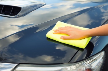 Polishing a car with a soft cloth. Polishing a car with a soft cloth.