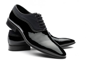A pair of shiny, black shoes. A pair of shiny, black shoes.