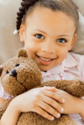 Her favorite teddy bear is her most special possession. Her favorite teddy bear is her most special possession.