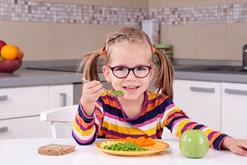 She has a preference for peas rather than carrots. She has a preference for peas rather than carrots.