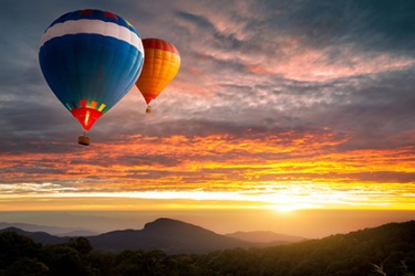 Hot air balloons flying during a pretty sunset. Hot air balloons flying during a pretty sunset.