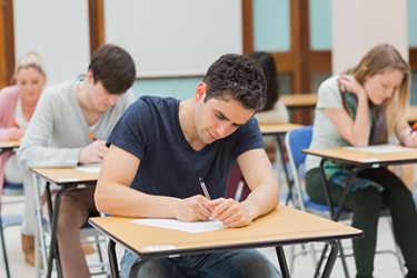 The teacher positioned the desks far apart for the test in order to prevent cheating. The teacher positioned the desks far apart for the test in order to prevent cheating.