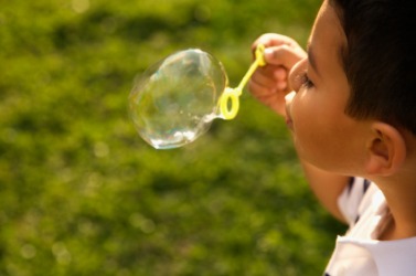 A child blowing a bubble. A child blowing a bubble.