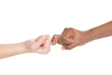 Two children making a pinky swear promise. Two children making a pinky swear promise.