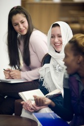 A group of young women studying together. A group of young women studying together.