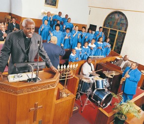 The preacher gives a sermon from the pulpit. The preacher gives a sermon from the pulpit.