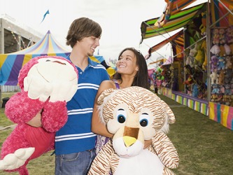 His quixotic strategy to impress his date by winning the large stuffed animals for her at the carnival seemed to be working. His quixotic strategy to impress his date by winning the large stuffed animals for her at the carnival seemed to be working.