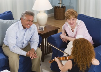 The grandparents listened with rapt attention to their granddaughter's violin performance. The grandparents listened with rapt attention to their granddaughter's violin performance.