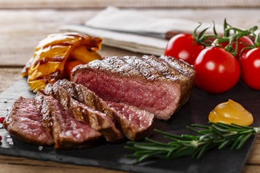 The steak is cooked to rare. The steak is cooked to rare.