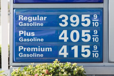 The sign at the convenience store shows the rate for gasoline. The sign at the convenience store shows the rate for gasoline.