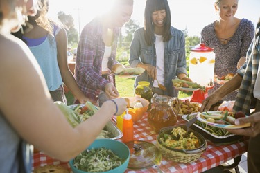 The close group of friends enjoy potluck picnics together because of the mutual reciprocity in which everyone brings an amazing dish. The close group of friends enjoy potluck picnics together because of the mutual reciprocity in which everyone brings an amazing dish.
