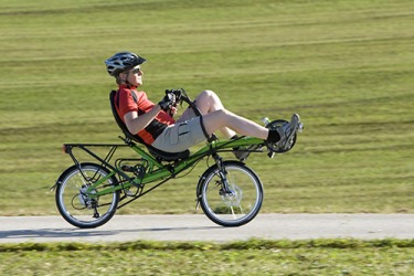 Jim always wears his helmet when he rides his recumbent bike . Jim always wears his helmet when he rides his recumbent bike .