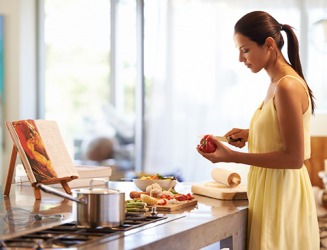 Jennifer uses a referential book to prepare dinner for her family. Jennifer uses a referential book to prepare dinner for her family.