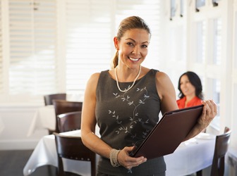 The restaurant hostess sat the customer at a table by the window. The restaurant hostess sat the customer at a table by the window.