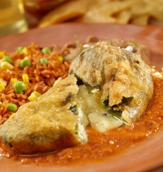 Chile relleno's are poblano chiles stuffed with a white cheese, then battered and fried. Chile relleno's are poblano chiles stuffed with a white cheese, then battered and fried.