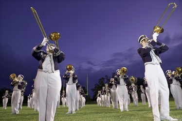 The high school marching band's repertoire of songs includes classic as well as pop music favorites. The high school marching band's repertoire of songs includes classic as well as pop music favorites.
