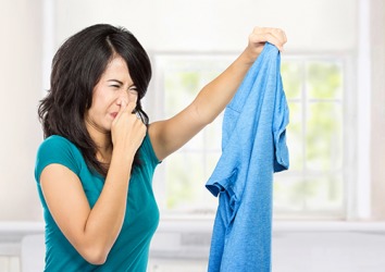 The repugnant odor from the shirt could only be eliminated by a thorough washing in hot, soapy water. The repugnant odor from the shirt could only be eliminated by a thorough washing in hot, soapy water.