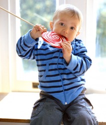 The lollipop left a sticky residue on Sean's face. The lollipop left a sticky residue on Sean's face.