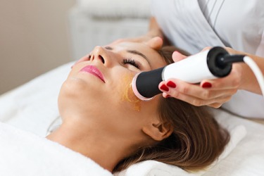 This woman is getting a cosmetic skin treatment to retard the effects of aging. This woman is getting a cosmetic skin treatment to retard the effects of aging.