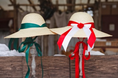 Two bonnets for sale at an open market. Two bonnets for sale at an open market.