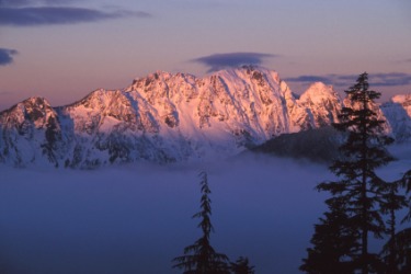 Alpenglow on snowy peaks. Alpenglow on snowy peaks.