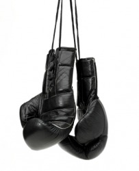 A pair of black boxing gloves. A pair of black boxing gloves.