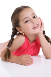 A little girl with her hair in braids. A little girl with her hair in braids.