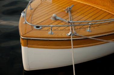 A closeup of the bow of a boat showing the silver brightwork. A closeup of the bow of a boat showing the silver brightwork.