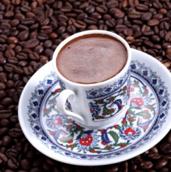 A cup brimful of coffee. A cup brimful of coffee.