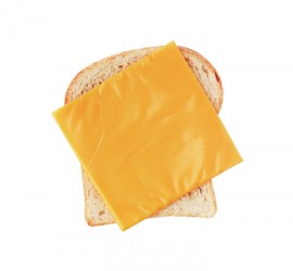 A slice of American cheese on bread. A slice of American cheese on bread.