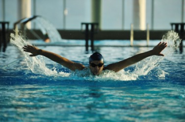 A swimmer doing the butterfly stroke. A swimmer doing the butterfly stroke.