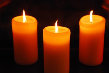 Three orange candles. Three orange candles.
