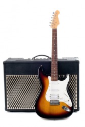 A guitar with its amplifier. A guitar with its amplifier.